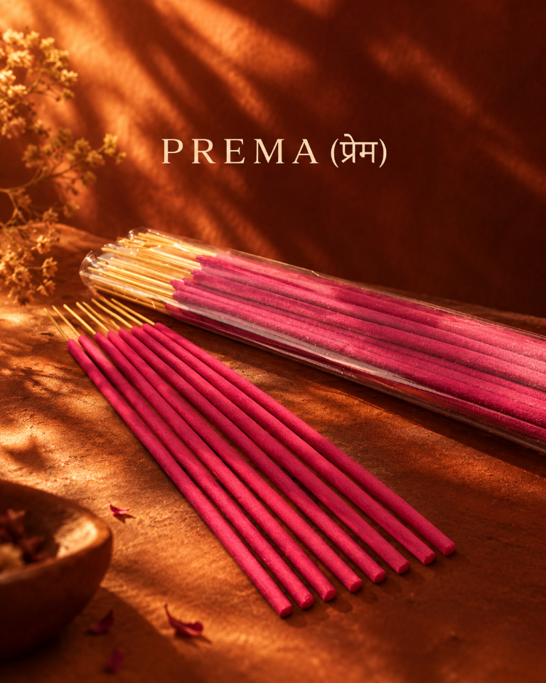 Prema Rose Incense Sticks by Ruhani in warm golden light